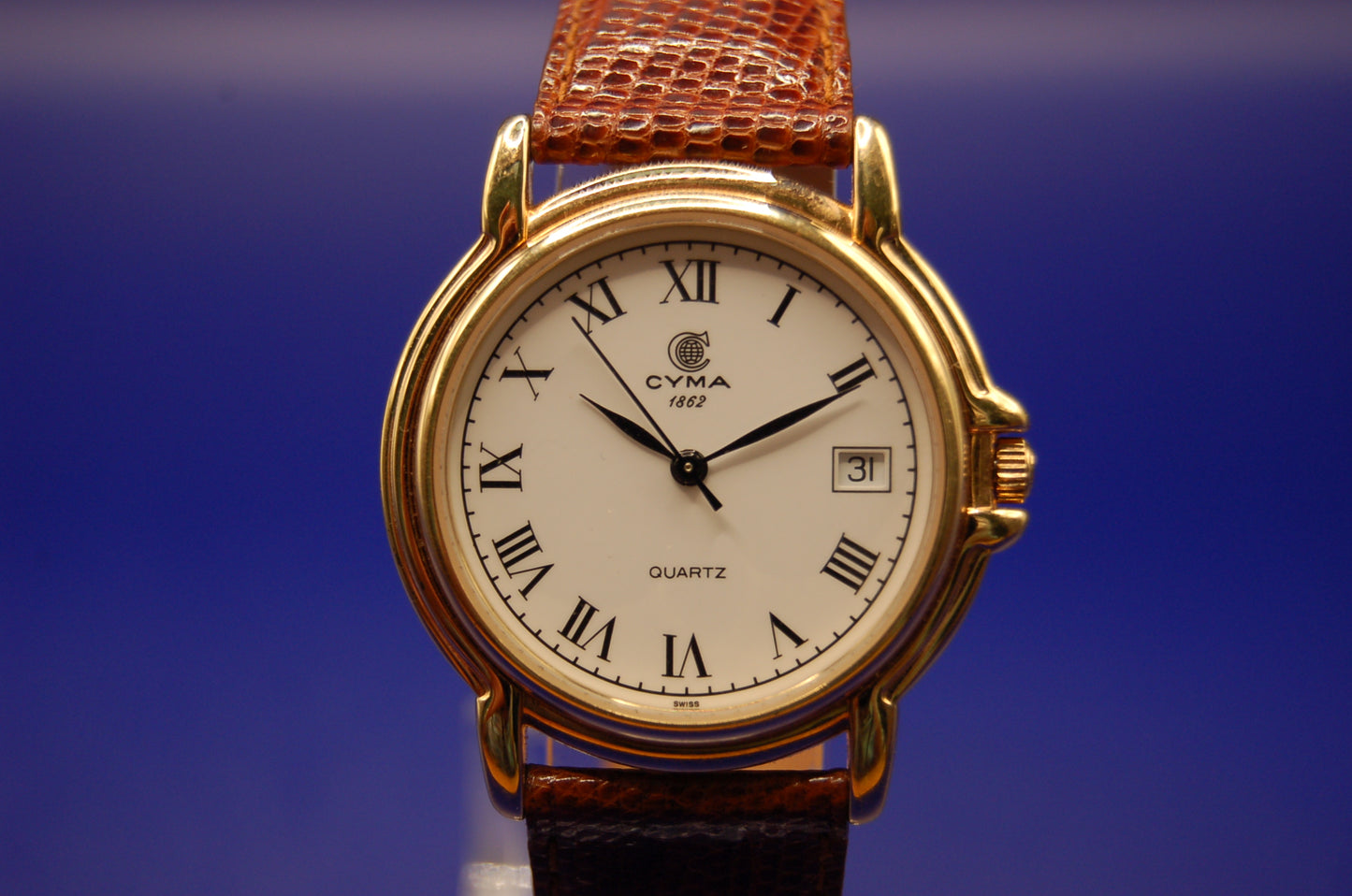 Cyma Armbanduhr – Quartz, Schweizer Uhrwerk, vergoldetes Gehäuse – Originalband & Dornschließe – Top-Zustand Uhr Juwelier Alen