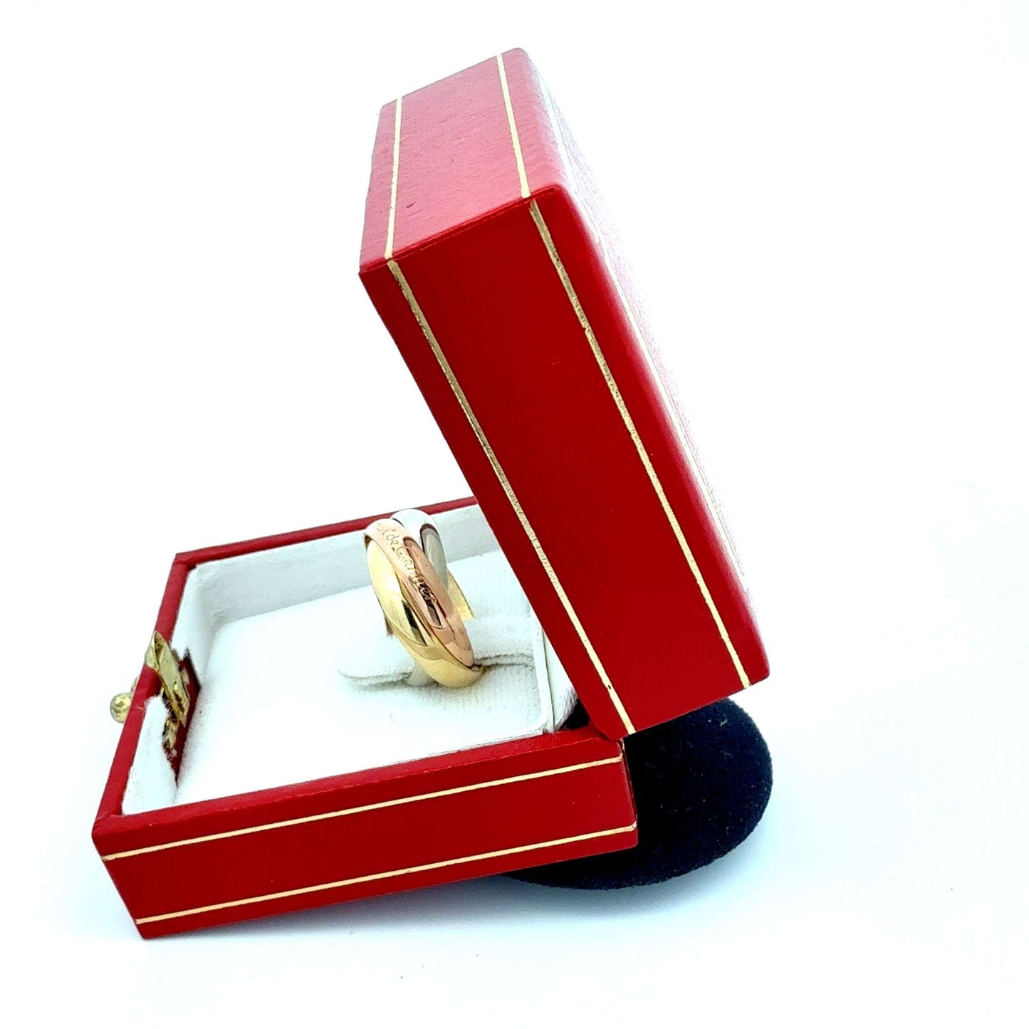 Goldener Cartier Trinity Ring mit drei ineinander verschlungenen Bändern, elegant und exklusiv, mit Echtheitszertifikat.